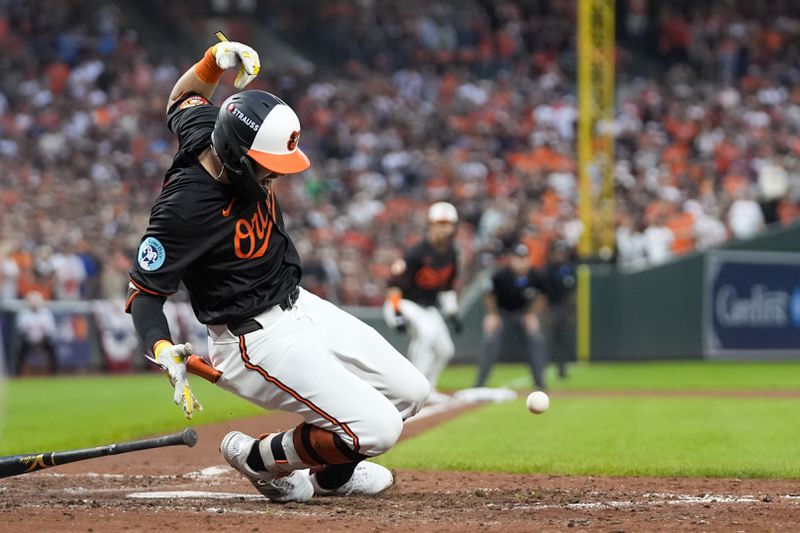 Baltimore Orioles' Colton Cowser reacts after being hit by a pitch from Kansas City Royals pitcher Angel Zerpa during the fifth inning in Game 2 of an AL Wild Card Series baseball game, Wednesday, Oct. 2, 2024 in Baltimore. (AP Photo/Stephanie Scarbrough)