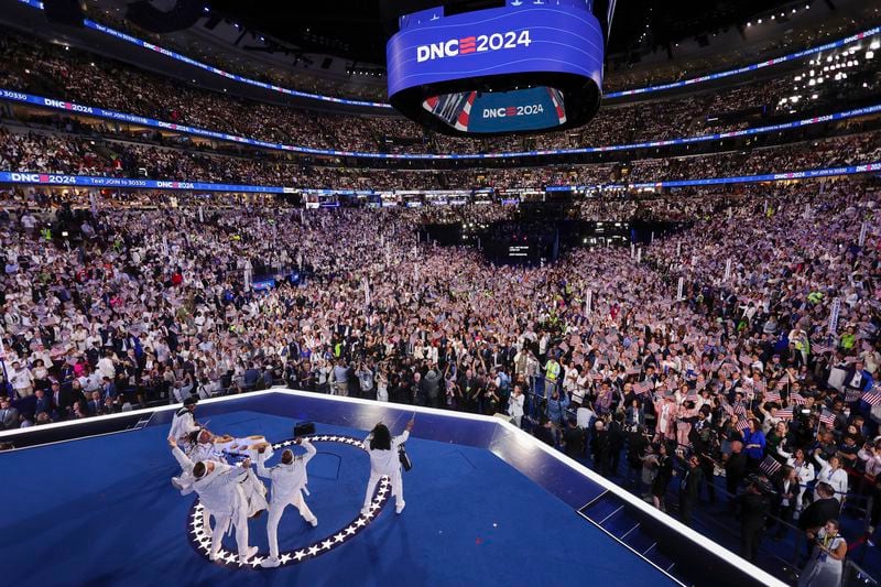 The Pack Drum Line, the official drum line of the Chicago Sky and the Chicago Bulls, perform during the final day of the Democratic National Convention in Chicago, Thursday, Aug. 21, 2024. (Mike Segar/Pool via AP)