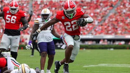 Georgia running back Branson Robinson (22) scores a 13-yard touchdown run during the third quarter against Tennessee Tech at Sanford Stadium, Saturday, Sept. 7, 2024, in Athens, Ga. Georgia won 48-3. (Jason Getz / AJC)
