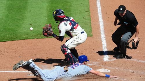 ATLANTA, GA - SEPTEMBER 13: Kevin Plawecki #22 of the New York Mets scores a seventh inning run against Christian Bethancourt #27 of the Atlanta Braves at Turner Field on September 13, 2015 in Atlanta, Georgia. (Photo by Scott Cunningham/Getty Images)