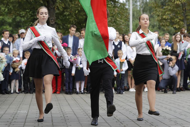 FILE - Schoolchildren march during the traditional opening of the school year, known as the Day of Knowledge, in Minsk, Belarus, on Sept. 1, 2018. (AP Photo, File)