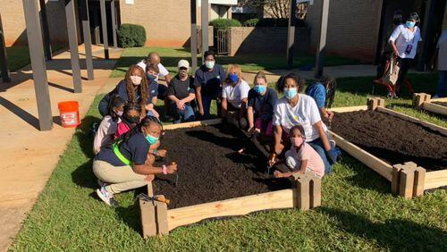 Students participate in their school gardening program sponsored by Live Healthy & Thrive Foundation. Courtesy of Live Healthy & Thrive Foundation