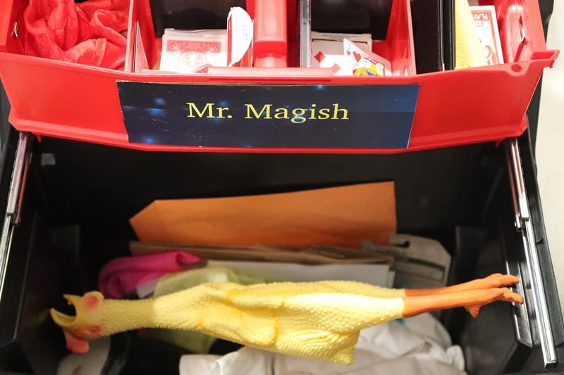 A variety of items, including a rubber chicken can be found in retired gastroenterologist Gary Peynard's magic box as he visits patients at the Memorial Health Dwaine and Cynthia Willett Children’s Hospital of Savannah.