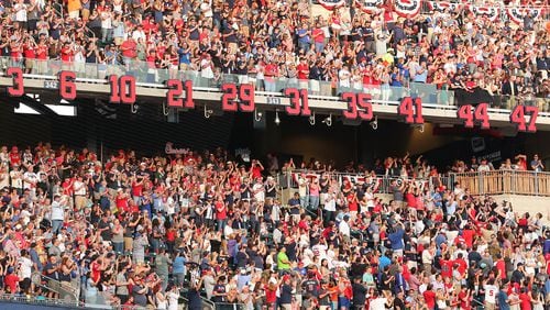 Braves players numbers, including Hank Aaron’s 44 are uncovered and retired during the Braves’ home opener against the Padres at SunTrust Park on Friday, April 14, 2017, in Atlanta. Curtis Compton/ccompton@ajc.com