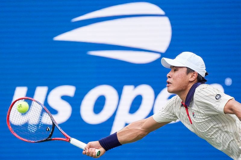 Brandon Nakashima, of the United States, returns a shot to Alexander Zverev of Germany, during the fourth round of the U.S. Open tennis championships, Sunday, Sept. 1, 2024, in New York. (AP Photo/Eduardo Munoz Alvarez)