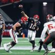 Falcons quarterback Kirk Cousins (18) throws the ball during the first half of an NFL football game against the Tampa Bay Buccaneers on Thursday, October 3, 2024, at Mercedes-Benz Stadium in Atlanta. 
(Miguel Martinez/ AJC)