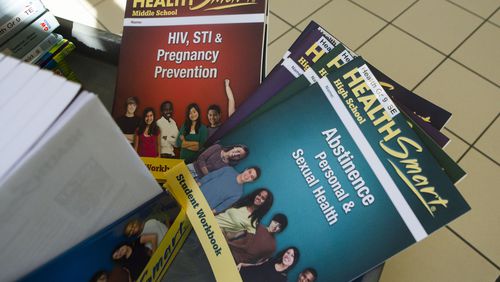 Comprehensive sexual and health education textbooks and learning materials are photographed on Wednesday, March 8, 2023, at Gwinnett County Schools Headquarters in Suwanee. The materials are being considered for use in Gwinnett County's sex education curriculum. (Christina Matacotta for The Atlanta Journal-Constitution)