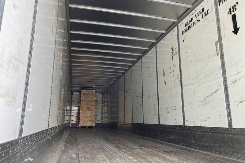 A crate holding a statue of Johnny Cash, destined for the U.S. Capitol, sits in the back of a tractor trailer parked outside the Arkansas Capitol in Little Rock, Ark., Thursday, Sept. 5, 2024. (AP Photo/Andrew DeMillo)