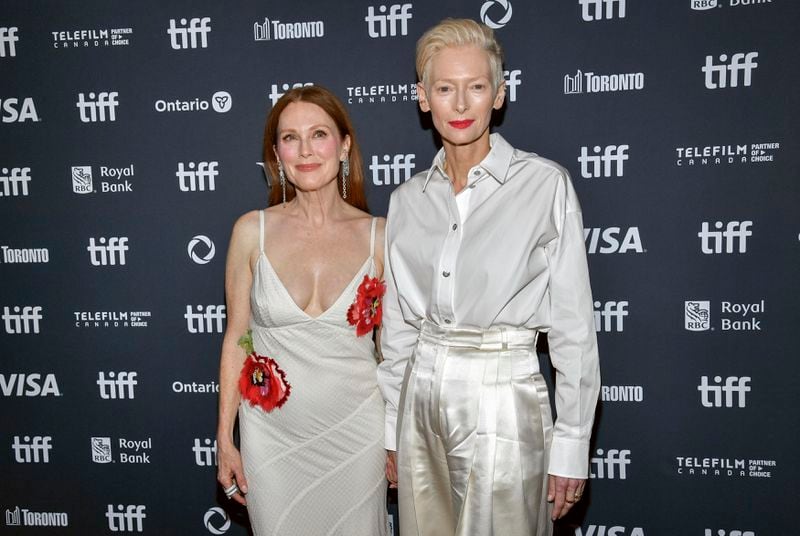 Julianne Moore, left, and Tilda Swinton attend the premiere of "The Room Next Door" at TIFF Lightbox during the Toronto International Film Festival on Saturday, Sept. 7, 2024, in Toronto. (Photo by Evan Agostini/Invision/AP)