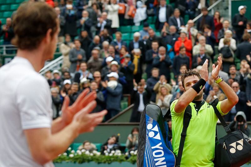 FILE - Britain's Andy Murray, left, applauds for Switzerland's Stan Wawrinka, right, after Murray won the semifinal match of the French Open tennis tournament in four sets, 6-4, 6-2, 4-6, 6-2, at the Roland Garros stadium in Paris, France, Friday, June 3, 2016. (AP Photo/Alastair Grant, File)