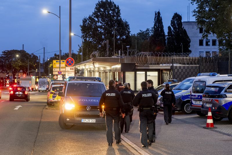 German police officers gather at the border between Germany and France in Kohl, Germany, Monday, Sept. 16, 2024 as Germany controls all his borders from Monday on. (AP Photo/Michael Probst)