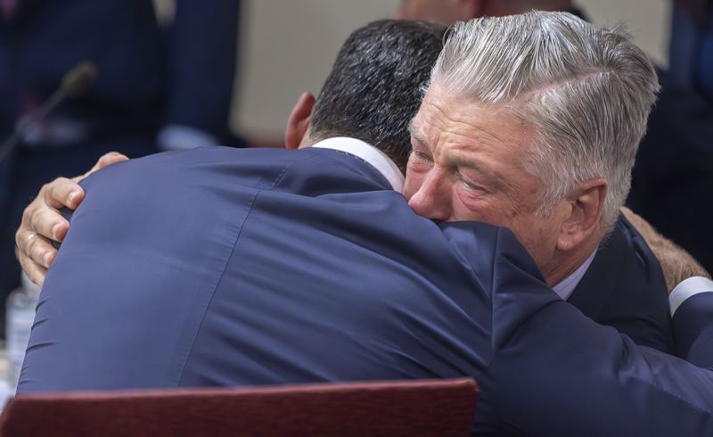 Actor Alec Baldwin, right, hugs his defense attorney Alex Spiro after District Court Judge Mary Marlowe Sommer threw out the involuntary manslaughter case for the 2021 fatal shooting of cinematographer Halyna Hutchins during filming of the Western movie "Rust," Friday, July 12, 2024, in Santa Fe, N.M. (Luis Sánchez Saturno/Santa Fe New Mexican via AP, Pool)
