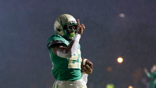 090222 Buford, Ga.: Buford running back Justice Haynes (22) reacts after scoring a touchdown during the first half against North Cobb at Tom Riden Stadium, Friday, September 2, 2022, in Buford, Ga. (Jason Getz / Jason.Getz@ajc.com)