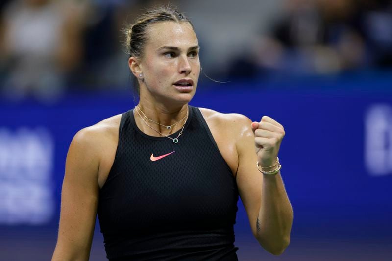 Aryna Sabalenka, of Belarus, pumps her fist after winning the first set against Zheng Qinwen, of China, during the quarterfinals of the U.S. Open tennis championships, Tuesday, Sept. 3, 2024, in New York. (AP Photo/Adam Hunger)