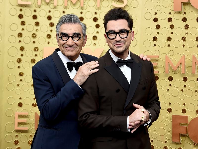 FILE - Eugene Levy, left, and Dan Levy appear at the 71st Primetime Emmy Awards in Los Angeles on Sept. 22, 2019. (Photo by Jordan Strauss/Invision/AP, File)