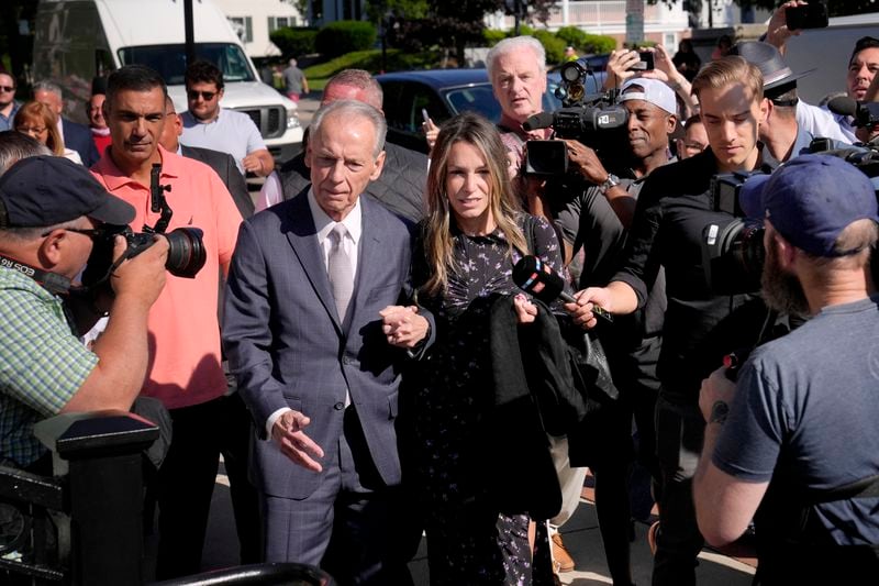 Karen Read, center, arrives at Norfolk Superior Court with her father William Read, Tuesday, June 25, 2024, in Dedham, Mass. Karen Read is on trial, accused of killing her boyfriend Boston police Officer John O'Keefe, in 2022. (AP Photo/Steven Senne)
