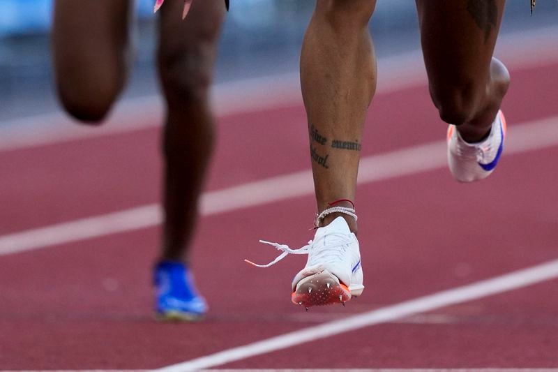 Sha'Carri Richardson wins a heat women's 100-meter run as her shoe appears to come untied during the U.S. Track and Field Olympic Team Trials Friday, June 21, 2024, in Eugene, Ore. (AP Photo/Charlie Neibergall)