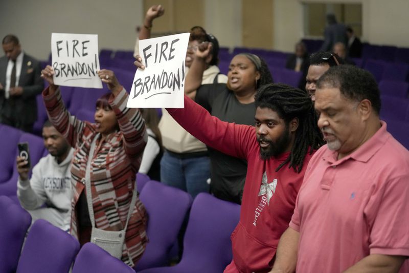 A group of residents disrupt a news conference as Chicago Mayor Brandon Johnson introduced six of his nominees to the Chicago Board of Education on Monday, Oct. 7, 2024, in Chicago. (AP Photo/Charles Rex Arbogast)