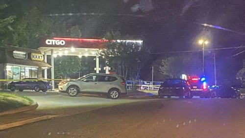 A suspect has been arrested and is facing a murder charge in connection with a gas station shooting in DeKalb County last week, police said Tuesday.