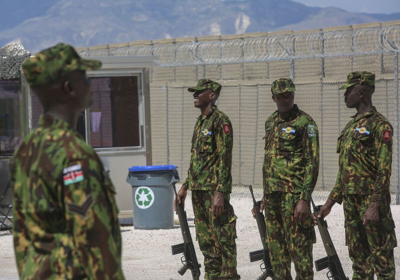 Kenyan police officers, part of a UN-backed multinational force, stand in formation on their base during a visit by Kenya's President William Ruto, in Port-au-Prince, Haiti, Saturday, Sept. 21, 2024. (AP Photo/Odelyn Joseph)