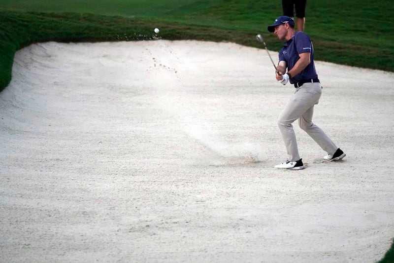 Max Greyserman hits from a sand trap on the 18th hole during the final round of the Wyndham Championship golf tournament in Greensboro, N.C., Sunday, Aug. 11, 2024. (AP Photo/Chuck Burton)