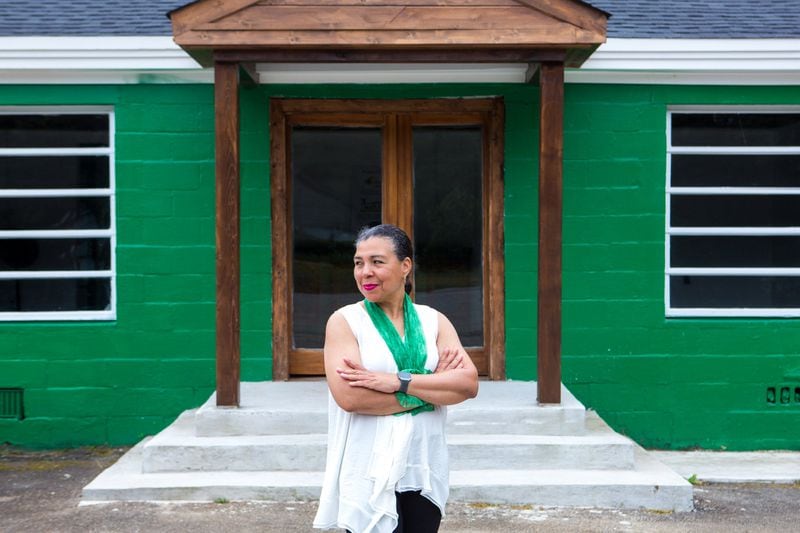 Diane Miller, the new owner of the Green Front Cafe, poses for a portrait in front of the cafe in Stockbridge, Ga., on Tuesday, June 4, 2019. The small building is a well-loved community fixture that thrived under the ownership of Carrie Mae Hambrick and served as a town watering hole from its opening in 1947 through the early 2000s. The cafe is now in the process of being revived under the ownership of Ms. Miller. (Casey Sykes for The Atlanta Journal-Constitution)