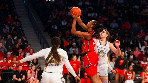 Georgia forward Jordan Cole rushes toward the net during the Tech-Georgia women's basketball game on Sunday, November 20, 2022, at Georgia Tech in Atlanta.  (CHRISTINA MATACOTTA FOR THE ATLANTA JOURNAL-CONSTITUTION)