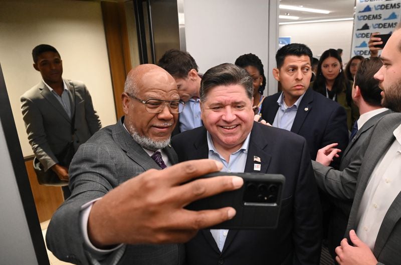 Former Georgia state Rep. Calvin Smyre (left) of Columbus takes a selfie with Illinois Gov. J.B. Pritzker during the Democratic National Convention in Chicago.