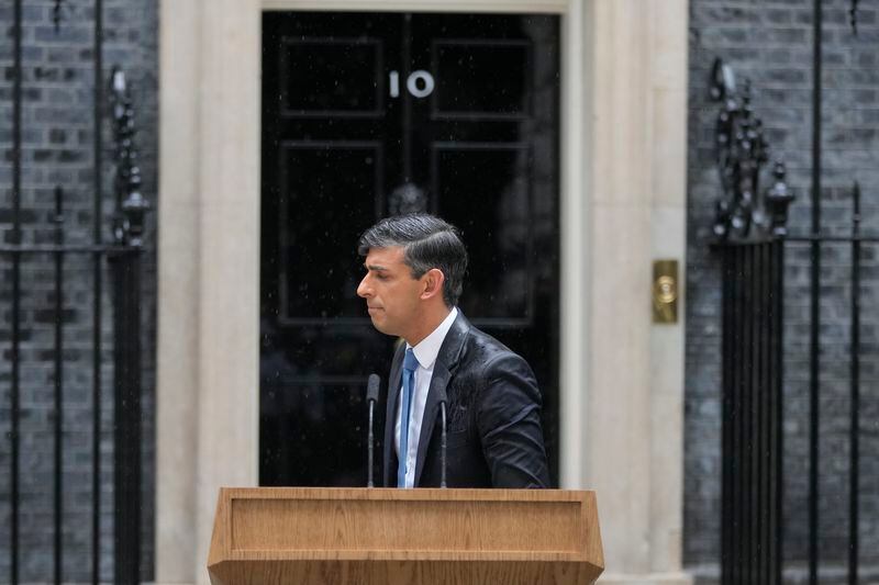 Britain's Prime Minister Rishi Sunak turns away after speaking to the media outside 10 Downing Street in London Wednesday, May 22, 2024, as he announced that he is to call a General Election for July 4. (AP Photo/Kin Cheung)