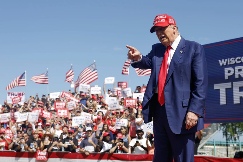 Republican presidential candidate former President Donald Trump walks to the podium at a campaign event Tuesday, June 18, 2024, in Racine, Wis. (AP Photo/Jeffrey Phelps)