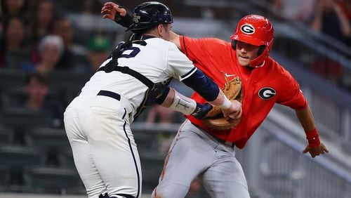 Georgia Tech catcher Kyle McCann tags out Georgia base runner Cam Shepherd as he tries to score from third on a ground ball during the Spring Classic game at SunTrust Park on Tuesday, April 23, 2019.  Curtis Compton / ccompton@ajc.com