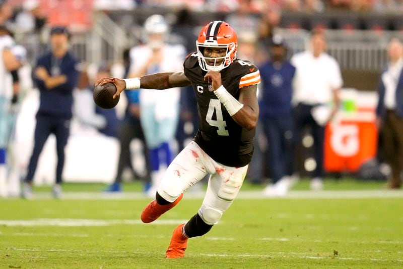 Cleveland Browns quarterback Deshaun Watson (4) runs the ball against the Dallas Cowboys in the second half of an NFL football game in Cleveland, Sunday, Sept. 8, 2024. (AP Photo/Sue Ogrocki)