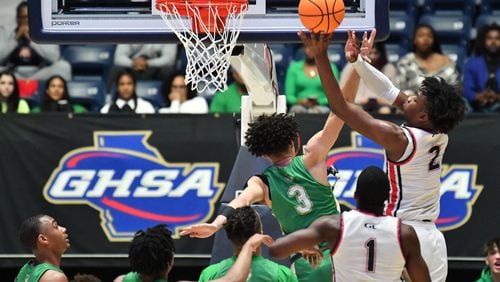 March 11, 2022 Macon - Grovetown's Frankquon Sherman (2) shoots over Buford's Jaylon Taylor (3) during the 2022 GHSA State Basketball Class AAAAAA Boys Championship game at the Macon Centreplex in Macon on Friday, March 11, 2022. (Hyosub Shin / Hyosub.Shin@ajc.com)