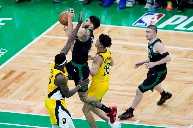 Boston Celtics forward Jayson Tatum drives to the basket against the Indiana Pacers during the first half of Game 2 of the NBA Eastern Conference basketball finals Thursday, May 23, 2024, in Boston. (AP Photo/Michael Dwyer)