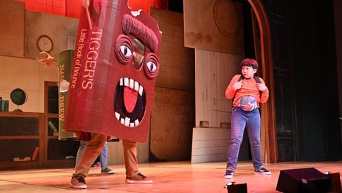 A book confronts Henry (Adrienne Ocfemia) in "The Incredible Book Eating Boy." Photo: Greg Mooney