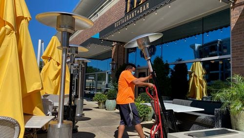 Restaurateur Dave Green purchased $20,000 worth of heaters to winterize the patios at his restaurants, the Select in Sandy Springs and Paces & Vine in Vinings. While other restaurateurs continue to scramble to get their hands on heaters, Green’s shipment of gas heaters arrived Sept. 30. Courtesy of the Select