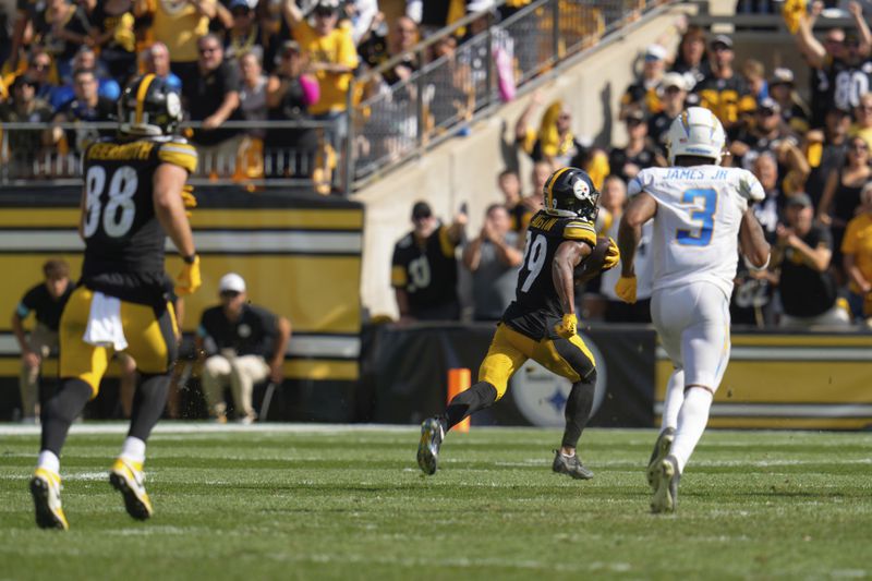 Pittsburgh Steelers wide receiver Calvin Austin III (19) runs with the ball after a catch for a touchdown during the second half of an NFL football game against the Los Angeles Chargers, Sunday, Sept. 22, 2024, in Pittsburgh. (AP Photo/Gene J. Puskar)