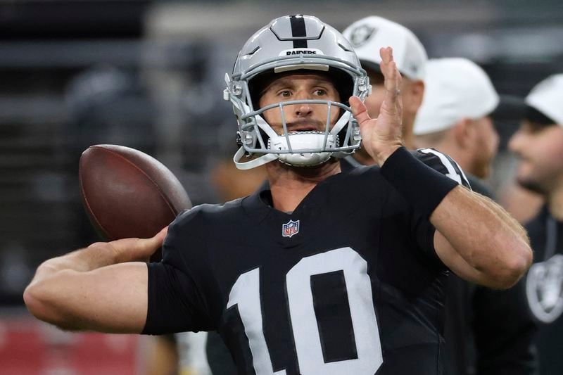 Las Vegas Raiders quarterback Nathan Peterman (10) warms up before an NFL preseason football game against the San Francisco 49ers, Friday, Aug. 23, 2024, in Las Vegas. (AP Photo/Ian Maule)