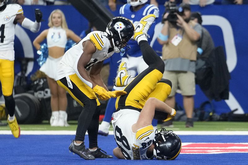 Pittsburgh Steelers tight end Pat Freiermuth (88) falls into the end zone for a touchdown during the second half of an NFL football game against the Indianapolis Colts, Sunday, Sept. 29, 2024, in Indianapolis. (AP Photo/Michael Conroy)