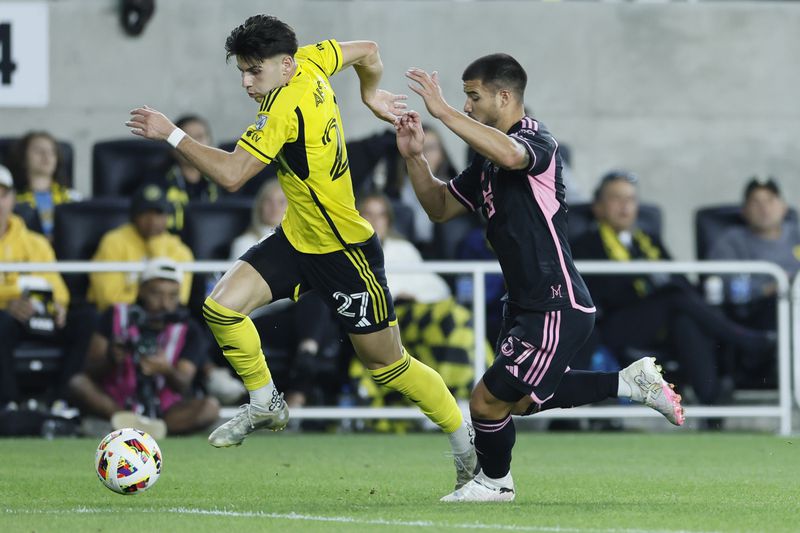 Inter Miami's Marcelo Weigandt, right, chases Columbus Crew's Maximilian Arfsten during the first half of an MLS soccer match Wednesday, Oct. 2, 2024, in Columbus, Ohio. (AP Photo/Jay LaPrete)