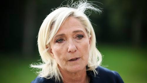 FILE - French far-right leader Marine Le Pen answers reporters at the Elysee Palace after a meeting with French President Emmanuel Macron, Aug. 26, 2024 in Paris. (AP Photo/Thomas Padilla, File)