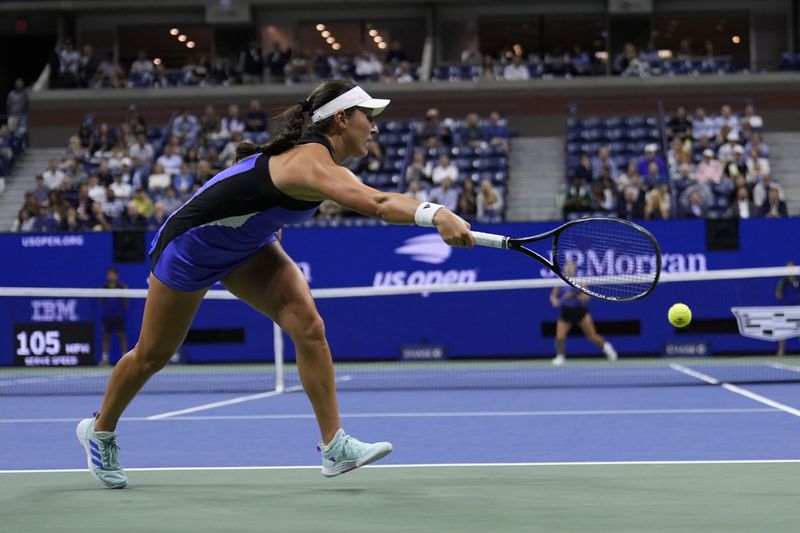 Jessica Pegula, of the United States, tries to returns a shot to Karolina Muchova, of the Czech Republic, during the women's singles semifinals of the U.S. Open tennis championships, Thursday, Sept. 5, 2024, in New York. (AP Photo/Seth Wenig)