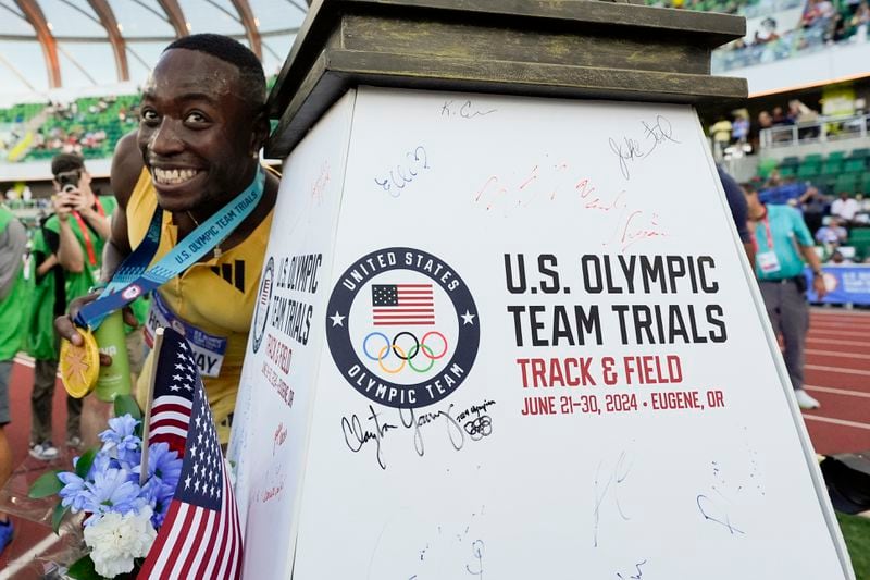 Grant Holloway celebrates after winning the men's 110-meter hurdles final during the U.S. Track and Field Olympic Team Trials Friday, June 28, 2024, in Eugene, Ore. (AP Photo/George Walker IV)