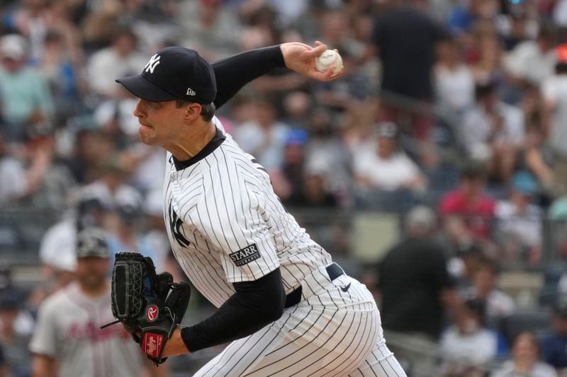 New York Yankees' Tommy Kahnle pitches during the eighth inning of a baseball game against the Atlanta Braves, Sunday, June 23, 2024, in New York. (AP Photo/Pamela Smith)