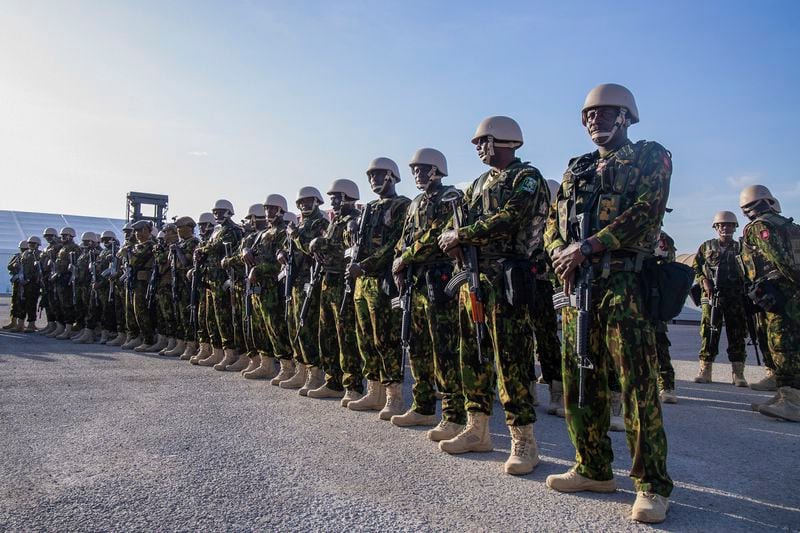 Kenyan police stand at their base during a visit by Haitian Prime Minister Garry Conille in Port-au-Prince, Haiti, Wednesday, June 26, 2024. The first contingent of U.N.-backed foreign police arrived the previous day, nearly two years after the Caribbean country requested help to quell gang violence. (AP Photo/Marckinson Pierre)