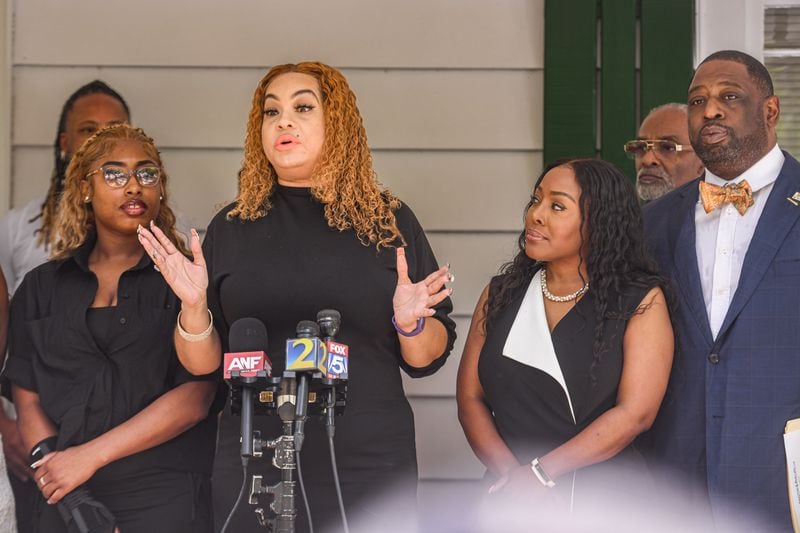 Madison Shannon Kelly talks to reporters Friday, when she thanked Douglas County Probate Judge Christina Peterson (second from right) for helping her friend, Alexandria Love, (left) during an altercation at a Buckhead nightclub. (Photo by Ziyu Julian Zhu/AJC)