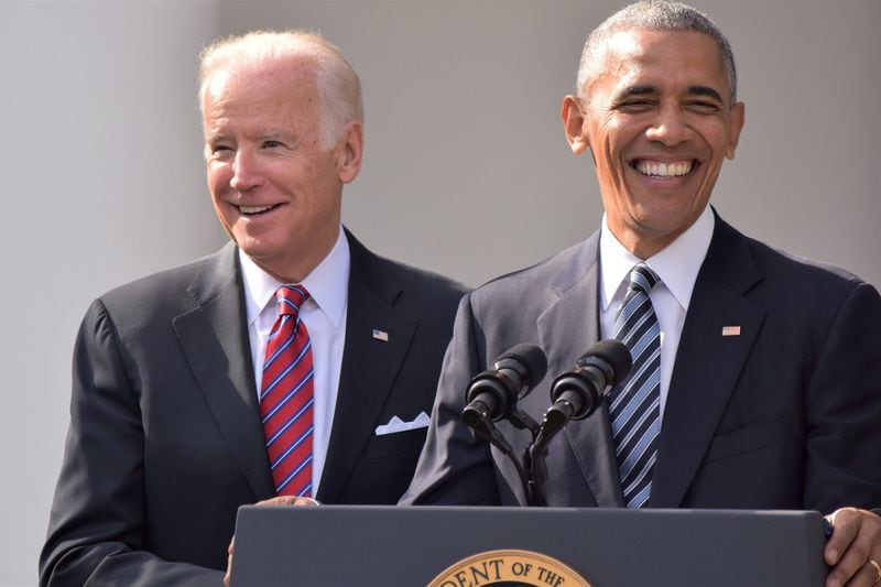 Then-President Barack Obama laughing with Vice President Joe Biden. Photo by Anna Wilding