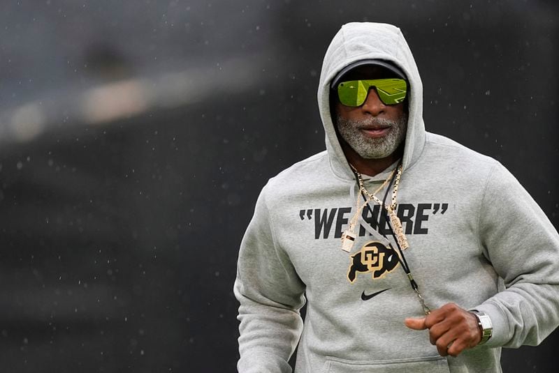 Colorado head coach Deion Sanders runs the perimeter of the field before an NCAA college football game against Baylor, Saturday, Sept. 21, 2024, in Boulder, Colo. (AP Photo/David Zalubowski)