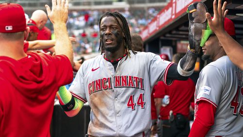 Cincinnati Reds' Elly De La Cruz (44) celebrates with teammates in the dugout after scoring in the first inning of a baseball game against the Atlanta Braves, Monday, July 22, 2024, in Atlanta. (AP Photo/Jason Allen)