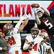 Atlanta Falcons wide receiver Drake London (5) goes up for an impressive reception during the fourth quarter against the Tampa Bay Buccaneers on Sunday, Dec. 10, 2023,  at Mercedes-Benz Stadium in Atlanta. 
Miguel Martinez/miguel.martinezjimenez@ajc.com